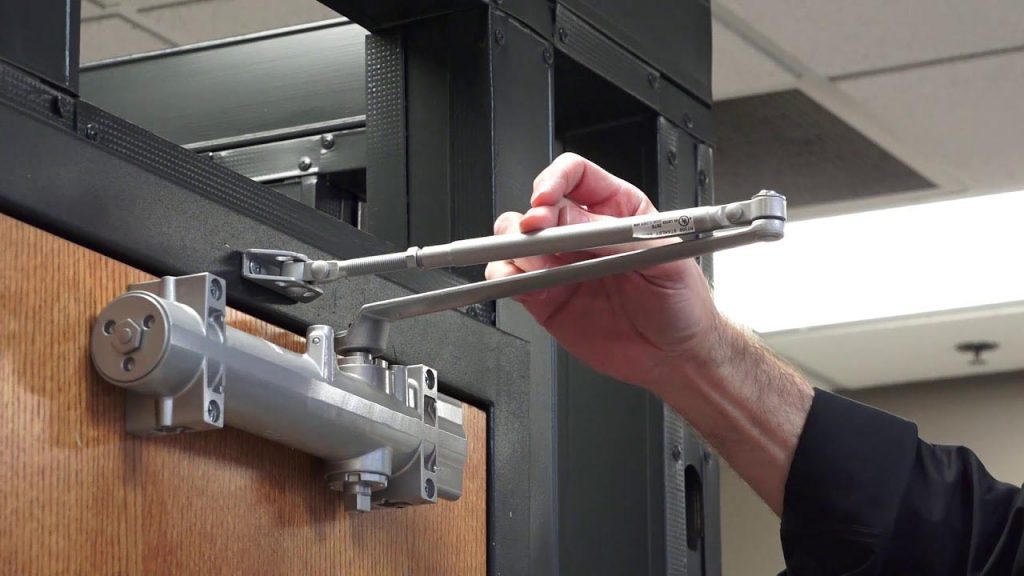 Technician fixing door slamming issue in Glenwood Springs