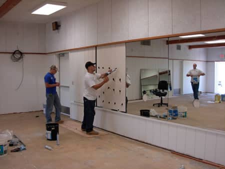 Gym mirror installation in Grand Junction fitness studio by Summit Glass technician