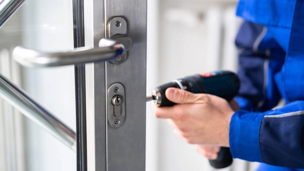 Technician repairing commercial door not locking in Grand Junction