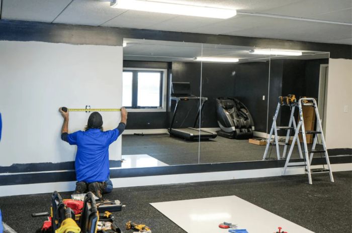 Gym mirror installation in Glenwood Springs fitness center by Summit Glass technician