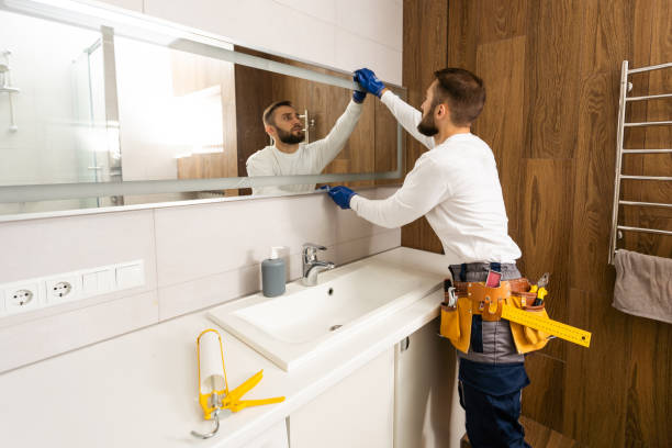 Bathroom mirror installation in Glenwood Springs home by Summit Glass technician