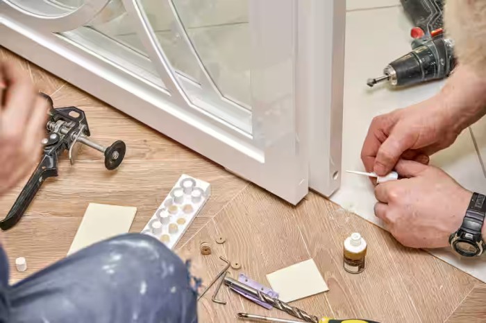 Technician performing same day glass door repair in Grand Junction
