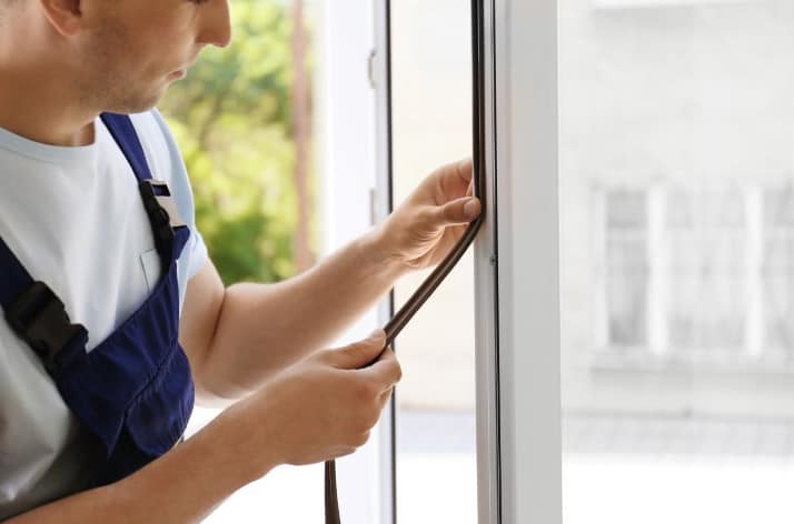 Technician performing door fixing in a Grand Junction property