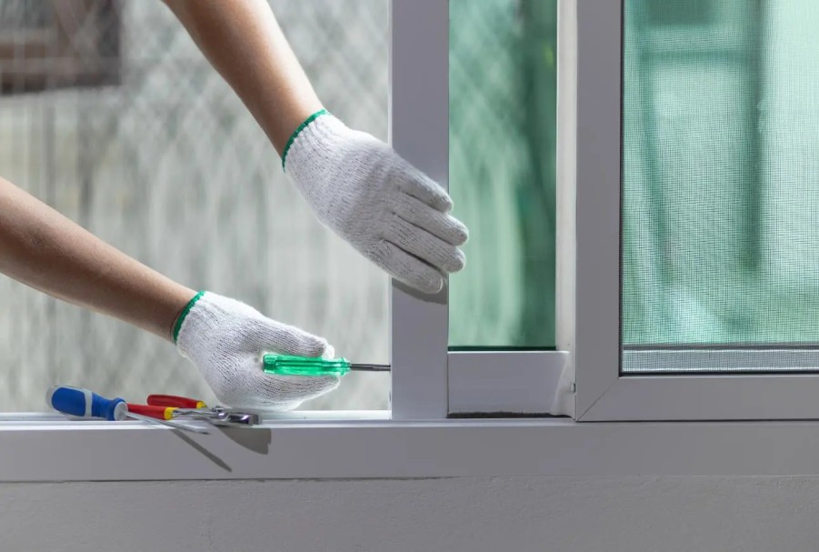 Technician performing professional door repair in Grand Junction
