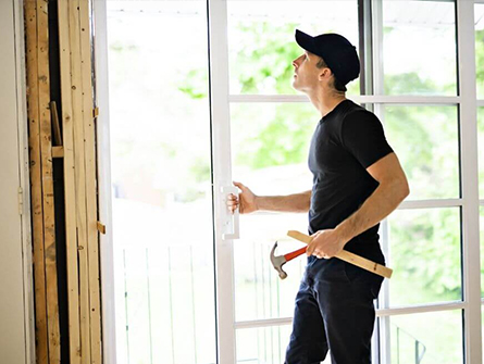 Technician performing trusted door repair in a Glenwood Springs property