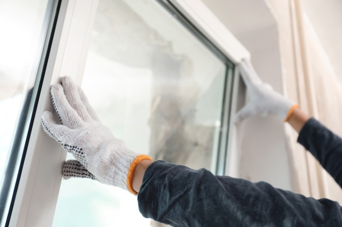 Professional technician repairing a window in Rifle